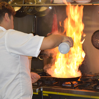Our chef carefully preparing dishes at Los Gatos